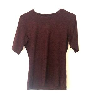 Never worsen maroon Kit and Ace shirt.